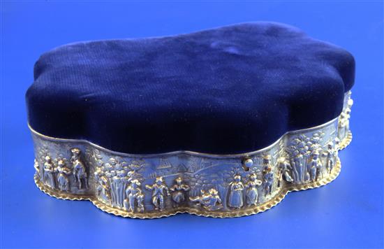 An Edwardian repousse silver mounted shell shaped trinket box, 8.5in.(-)